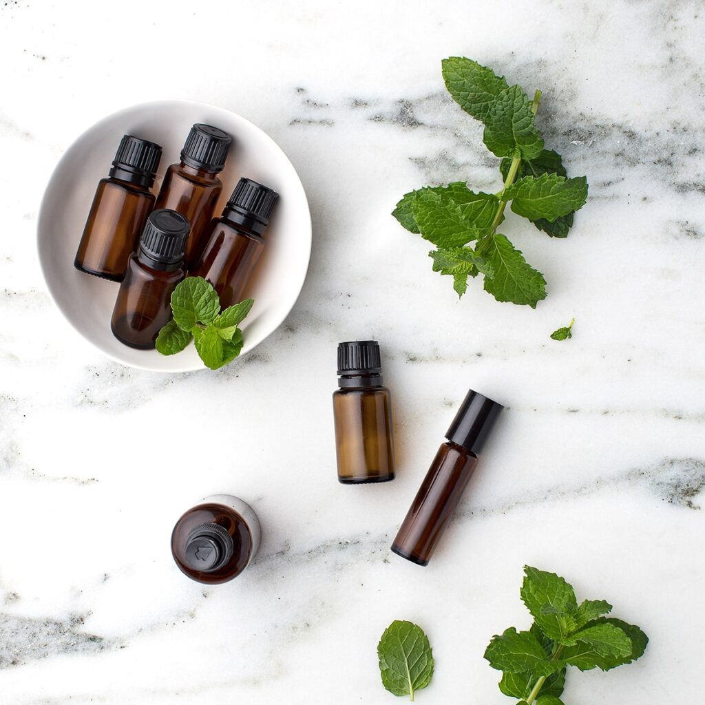 essential oils and leaves as natural remedy for postpartum healing