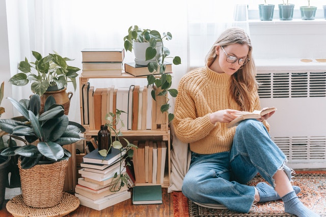 mom using spare time to read a book