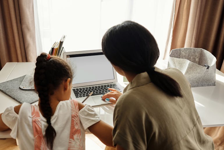 a mother studying with her child